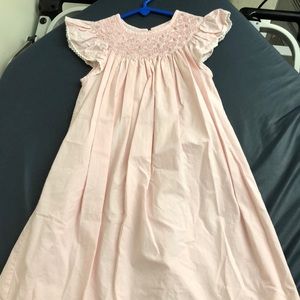 Pink smocked dress.